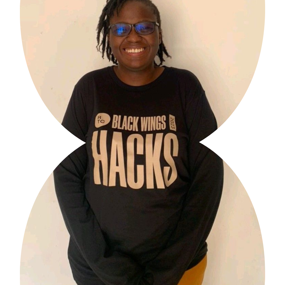 Woman wearing a Black Wings Hacks 2023 long sleeve shirt.