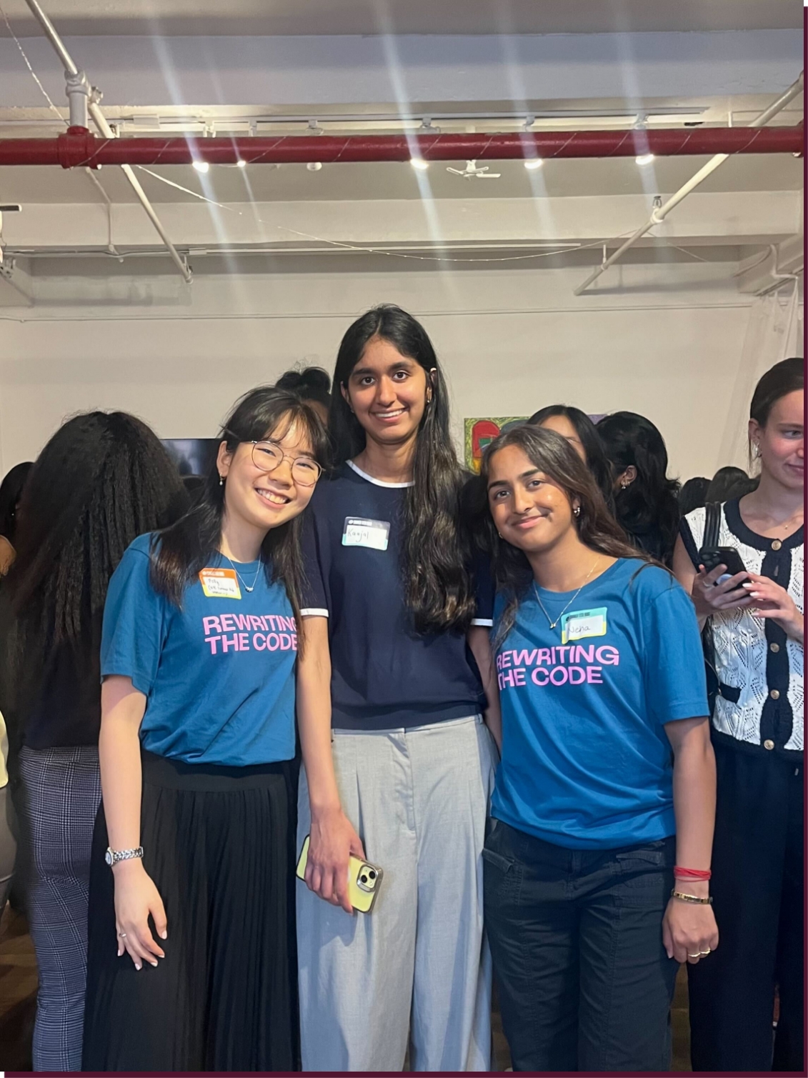 Group of three women smiling at a Rewriting the Code event
