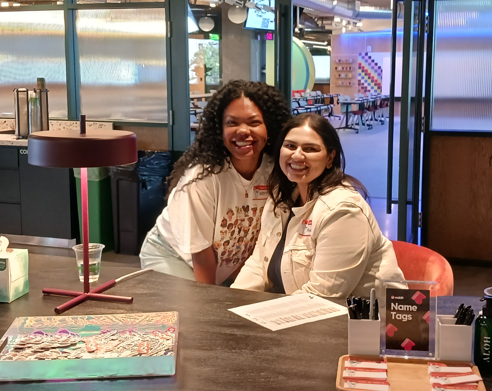 Two women smiling at a Rewriting the Code partner event