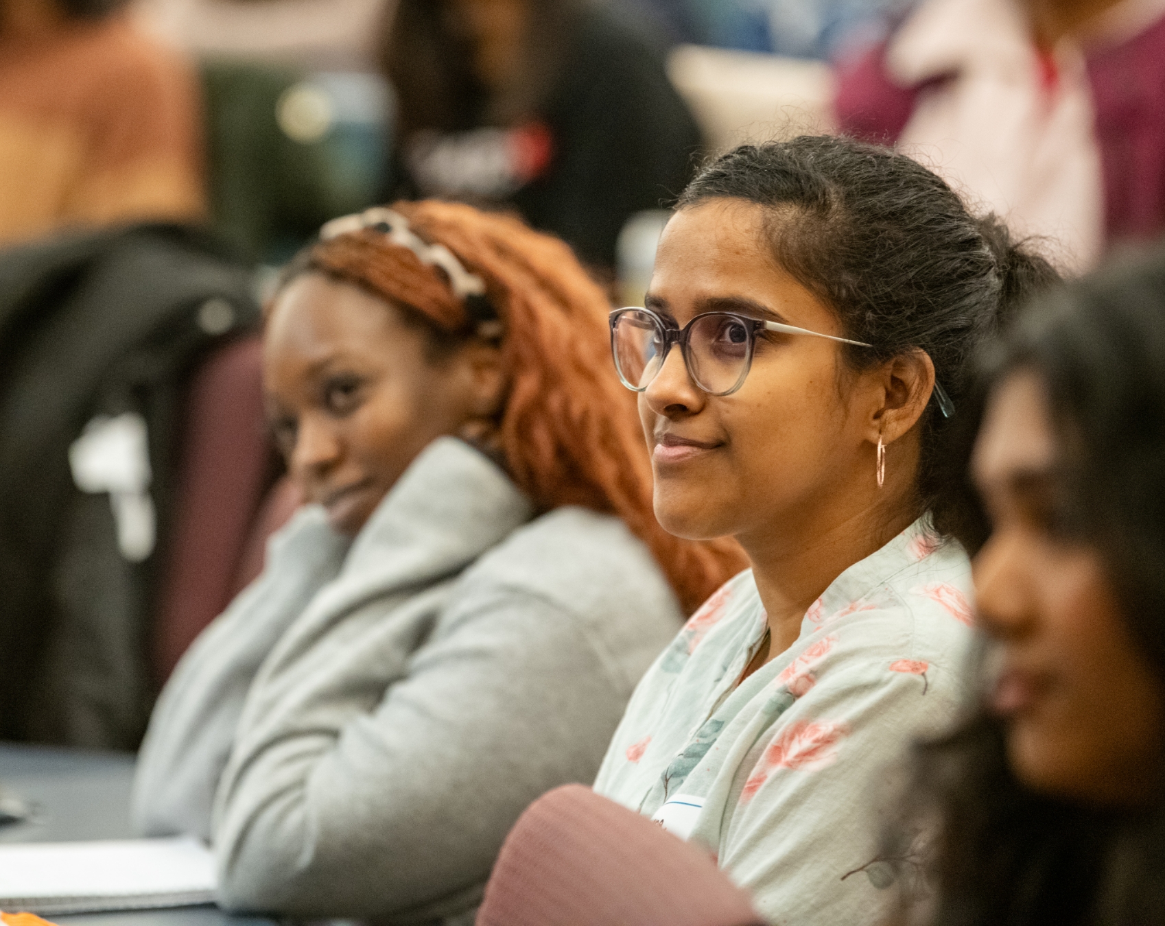 Woman in the audience at an RTC event