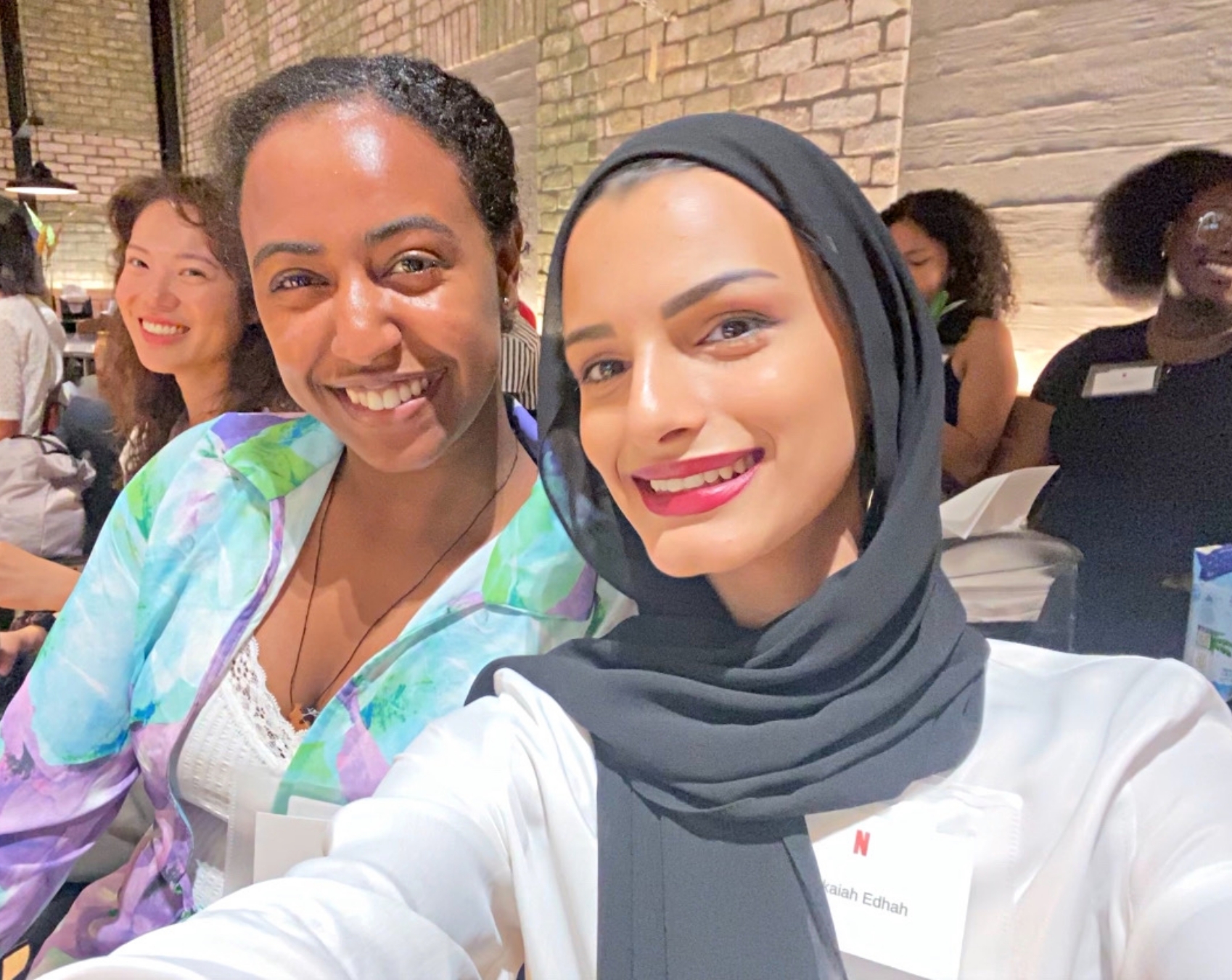 Two women smiling in a selfie at an RTC event