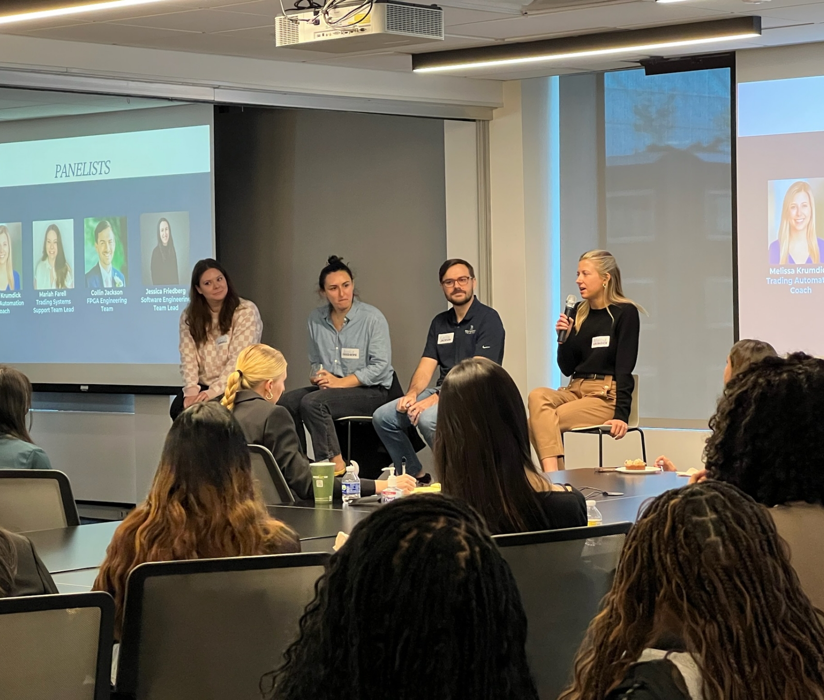 A group of panelists speaking to RTC members at an event