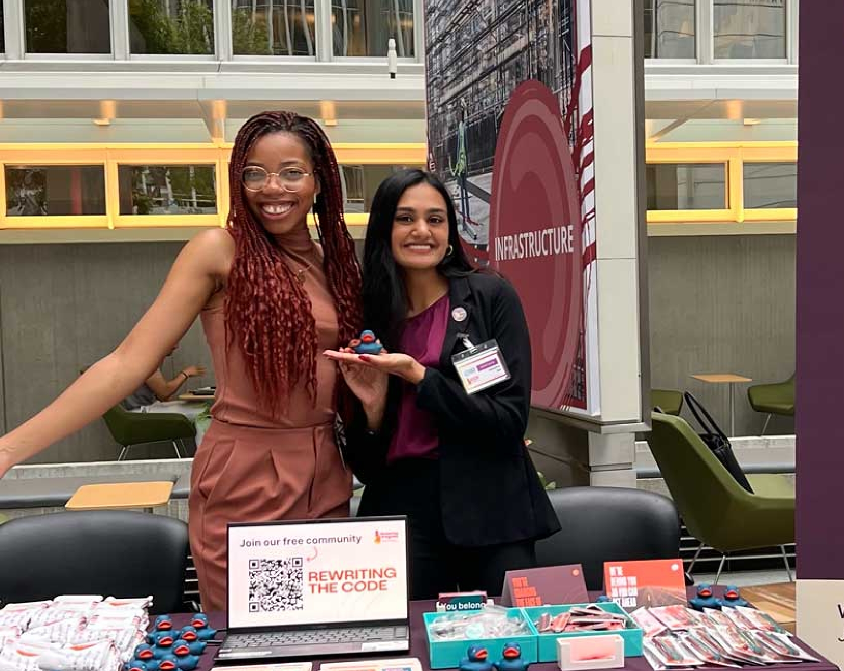 Blessing Adogame and Swada Rai at a table during a conference