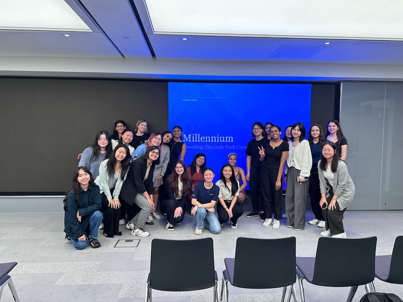 a large group of rtc members in front of a powerpoint