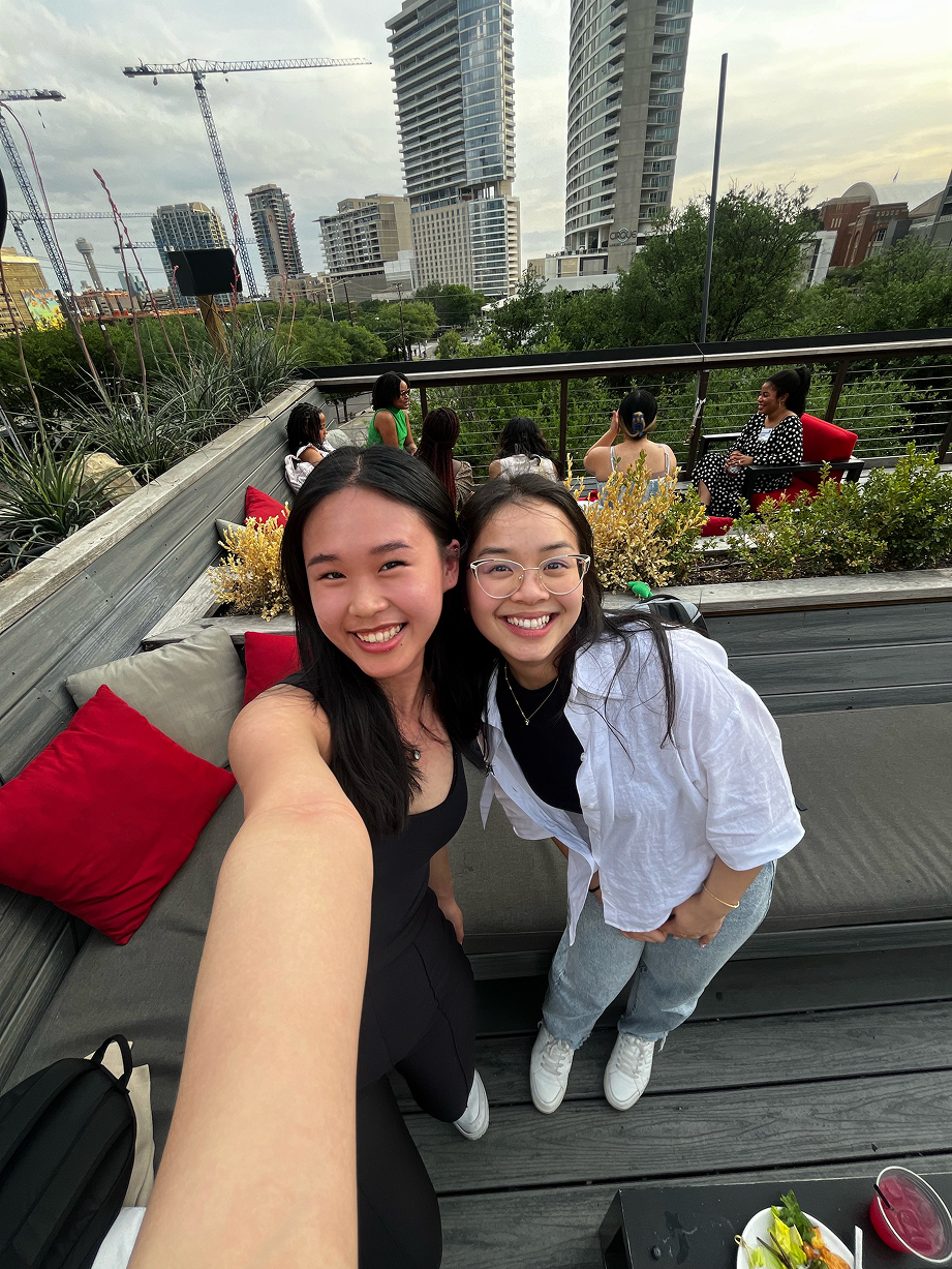 two women smiling in a selfie outside