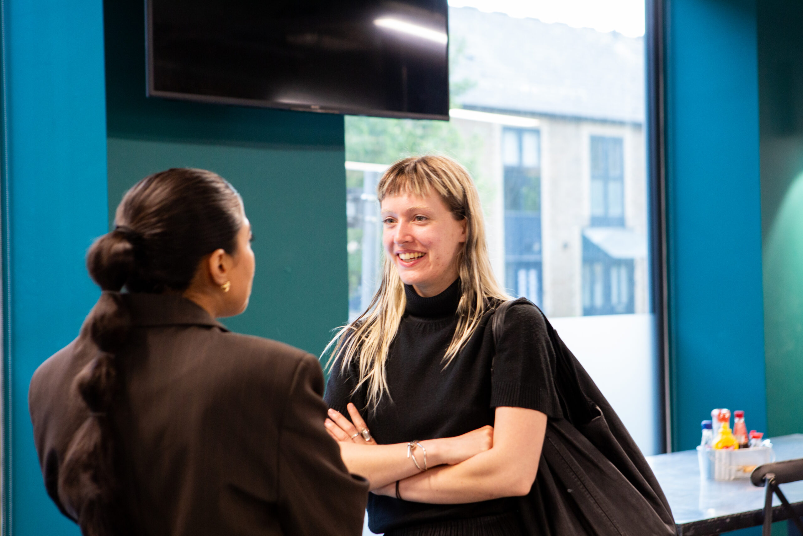 UK&I member speaking with woman in tech