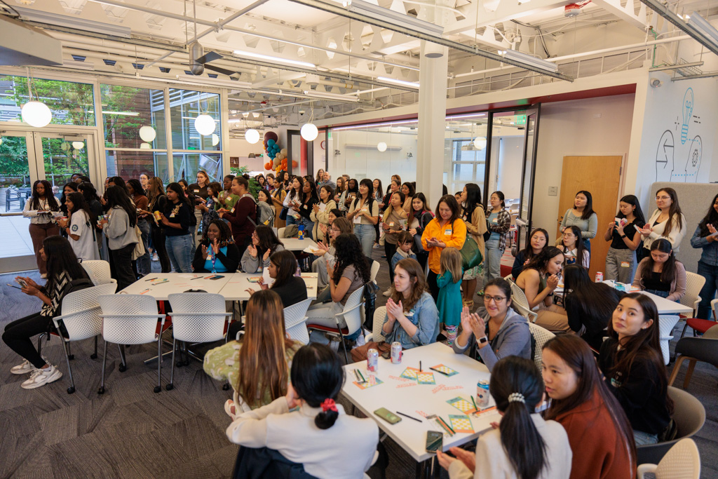 A large group of RTC members listening intently