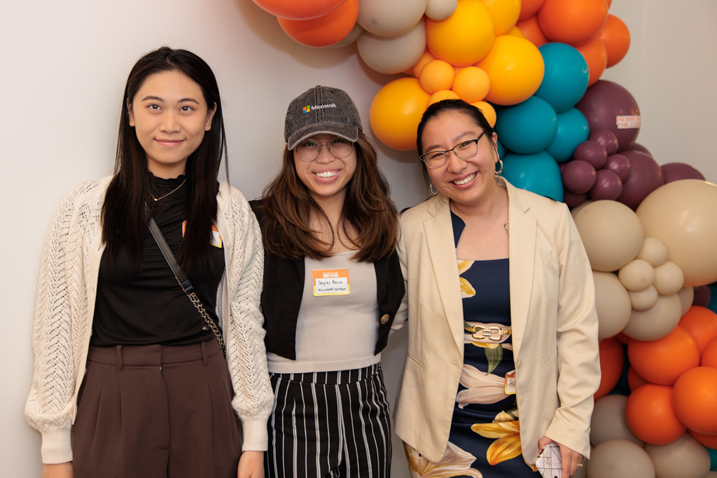 Group of 3 RTC members smiling at an event