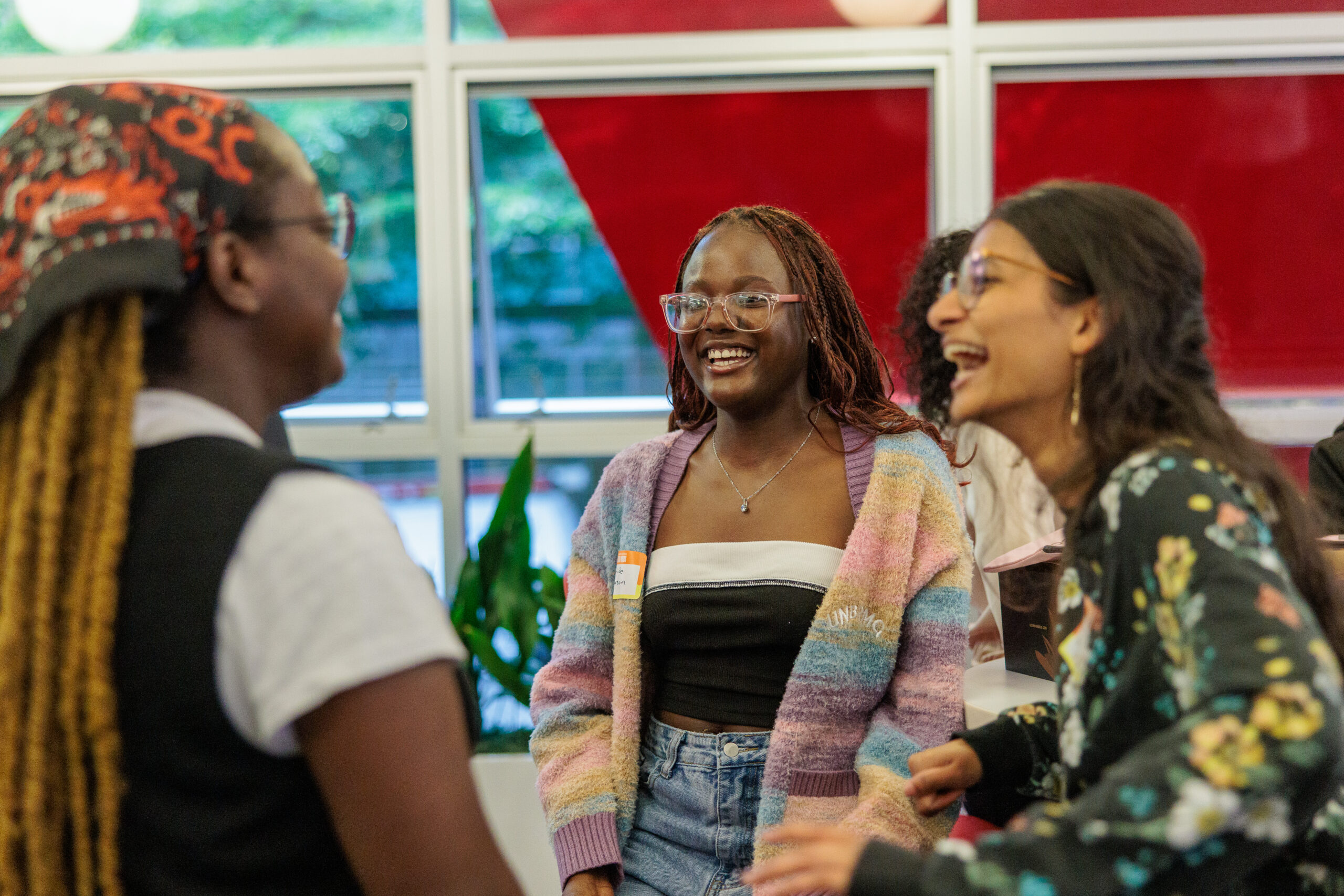 Three woman laughing at an RTC networking event