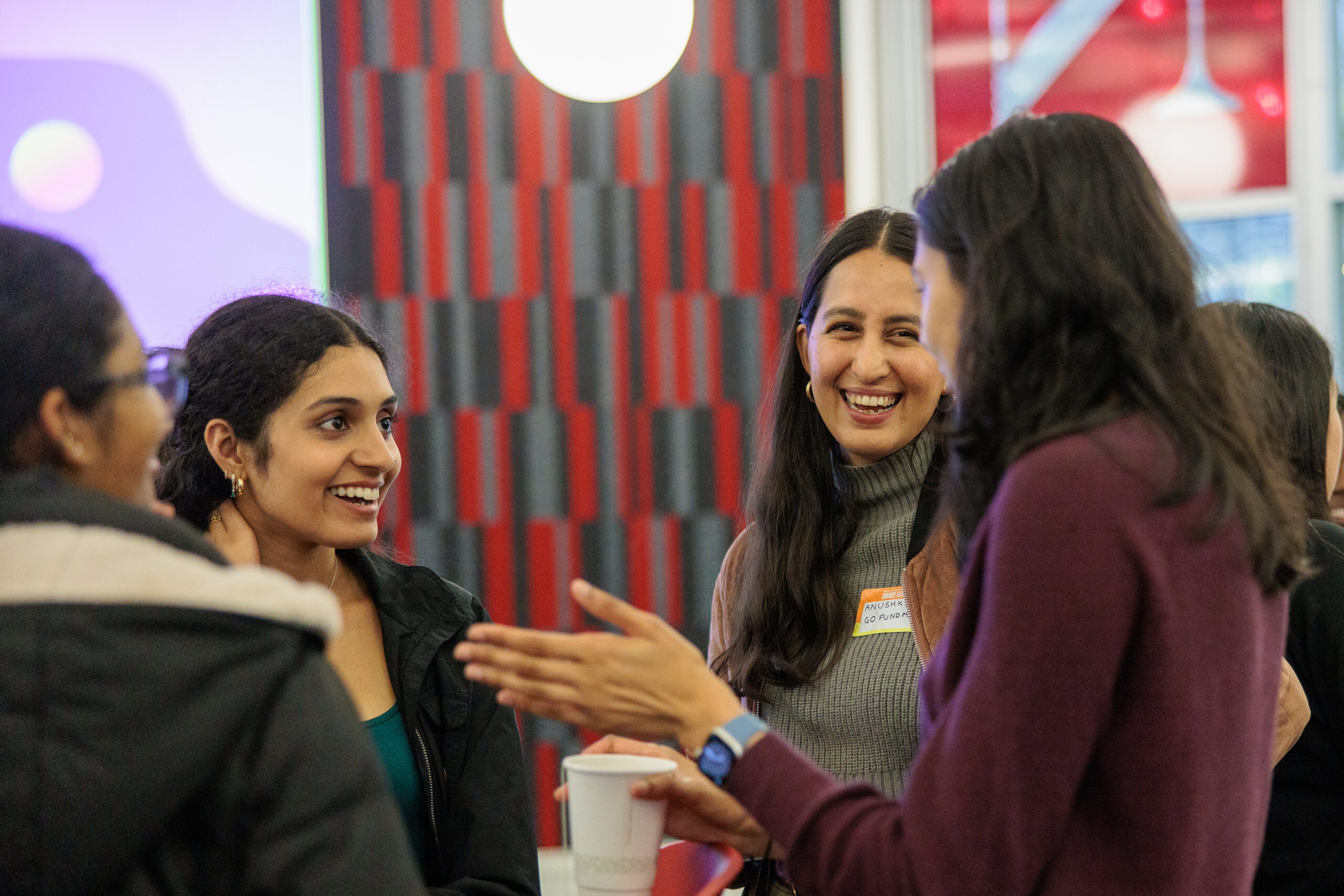 RTC women smiling at an event