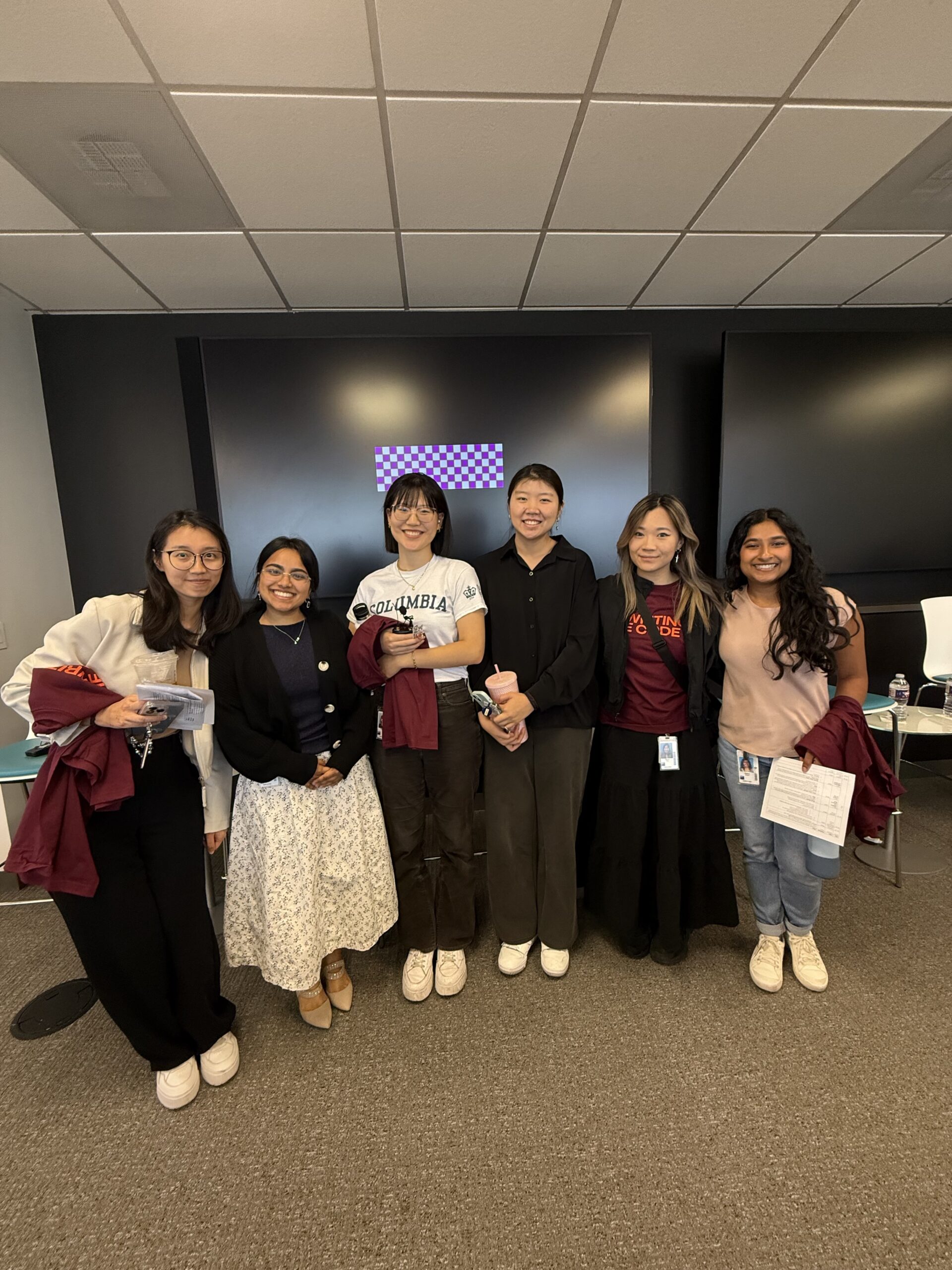Group of women smiling at a company event