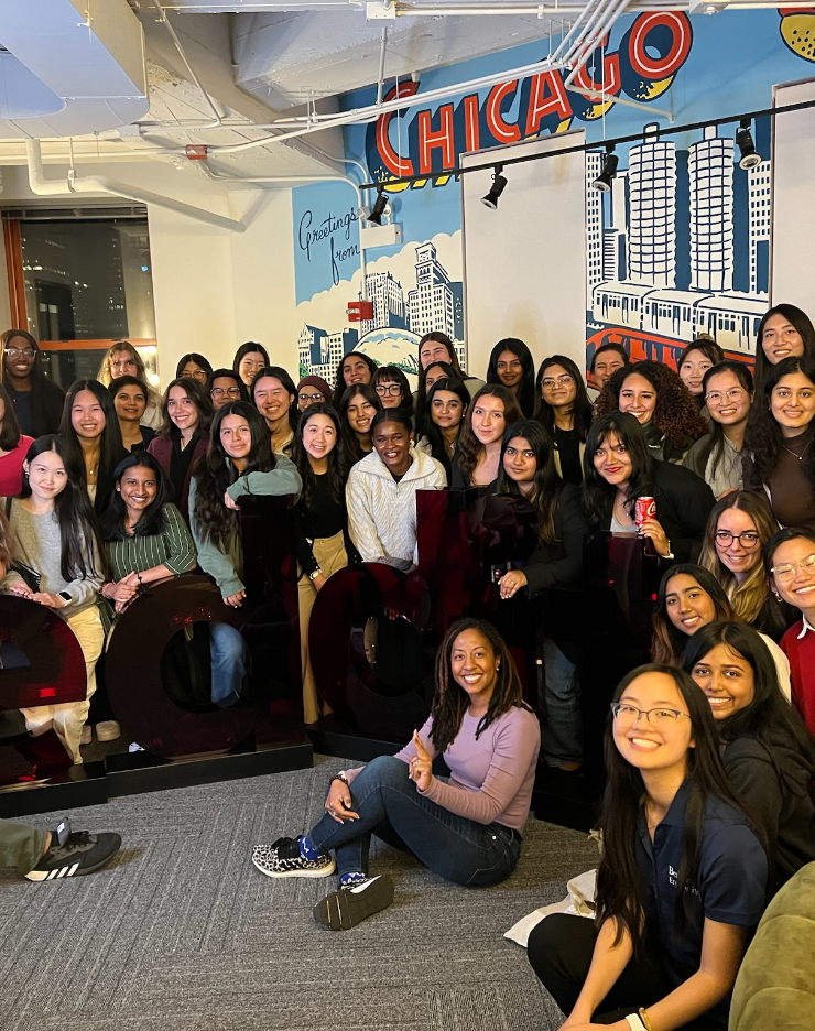 group of rtc women standing in front of a chicago mural