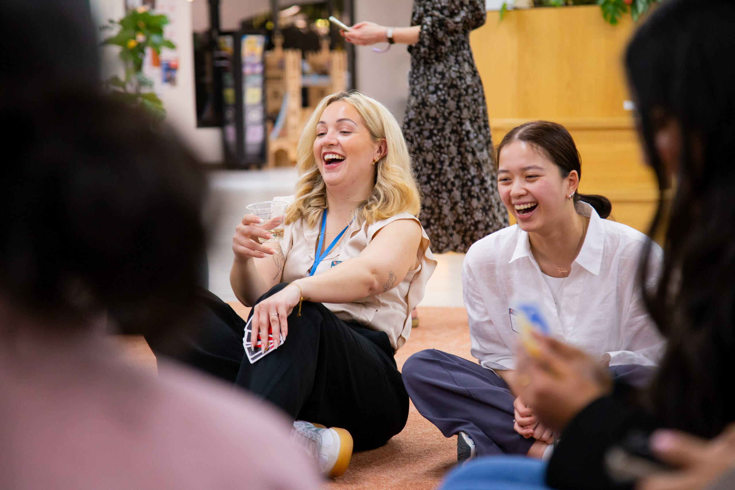 Two women laughing at an RTC UK event