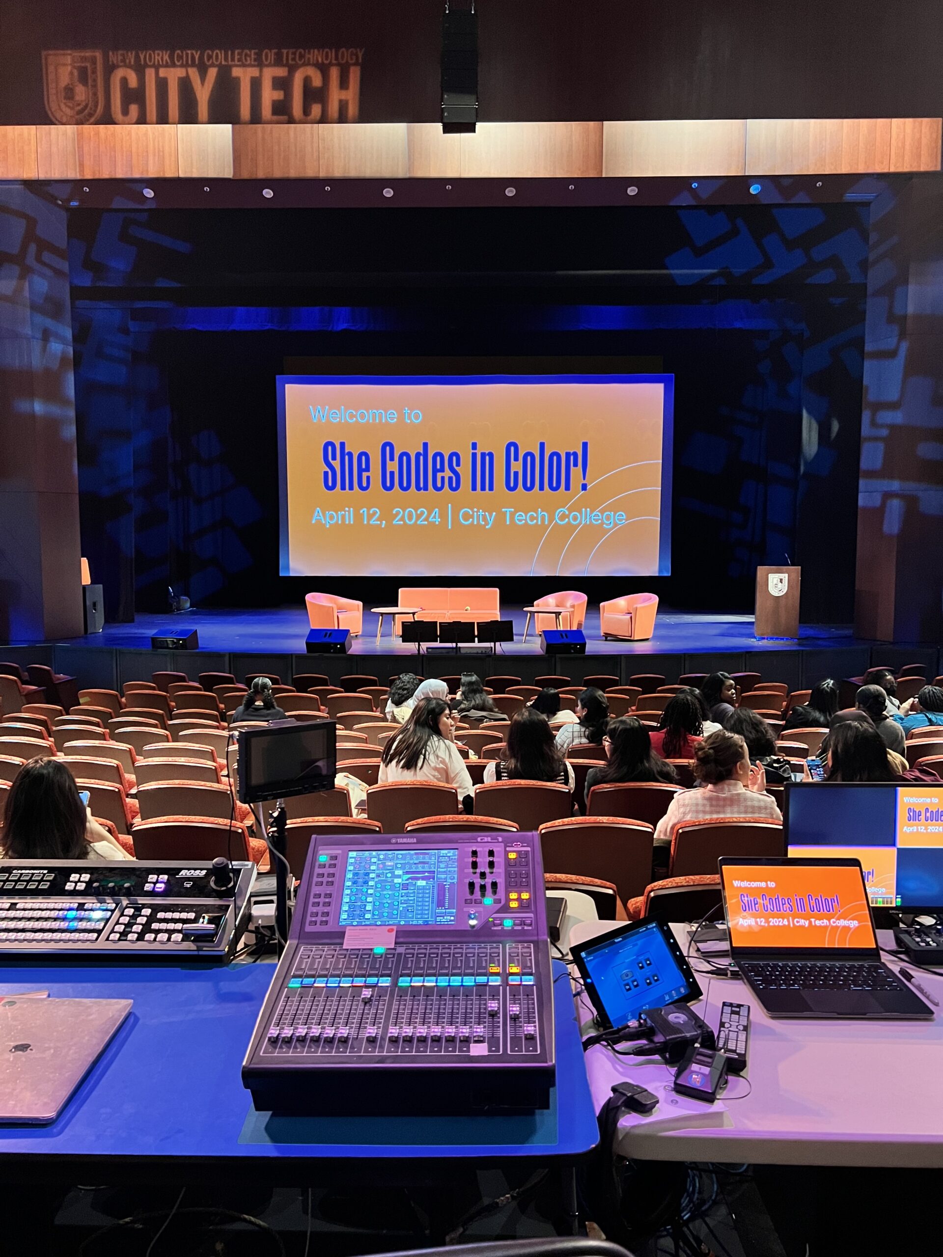 RTC event with powerpoint reading 'She Codes in Color'