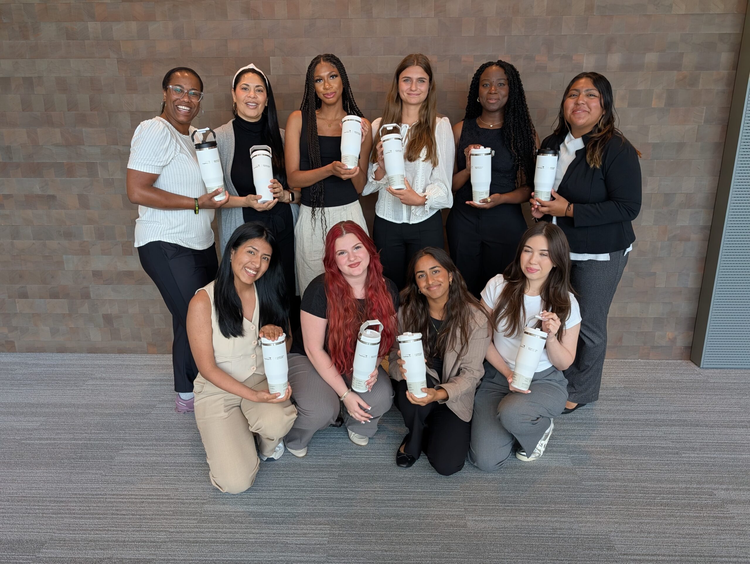 Group of women posing together with RTC coffee mugs