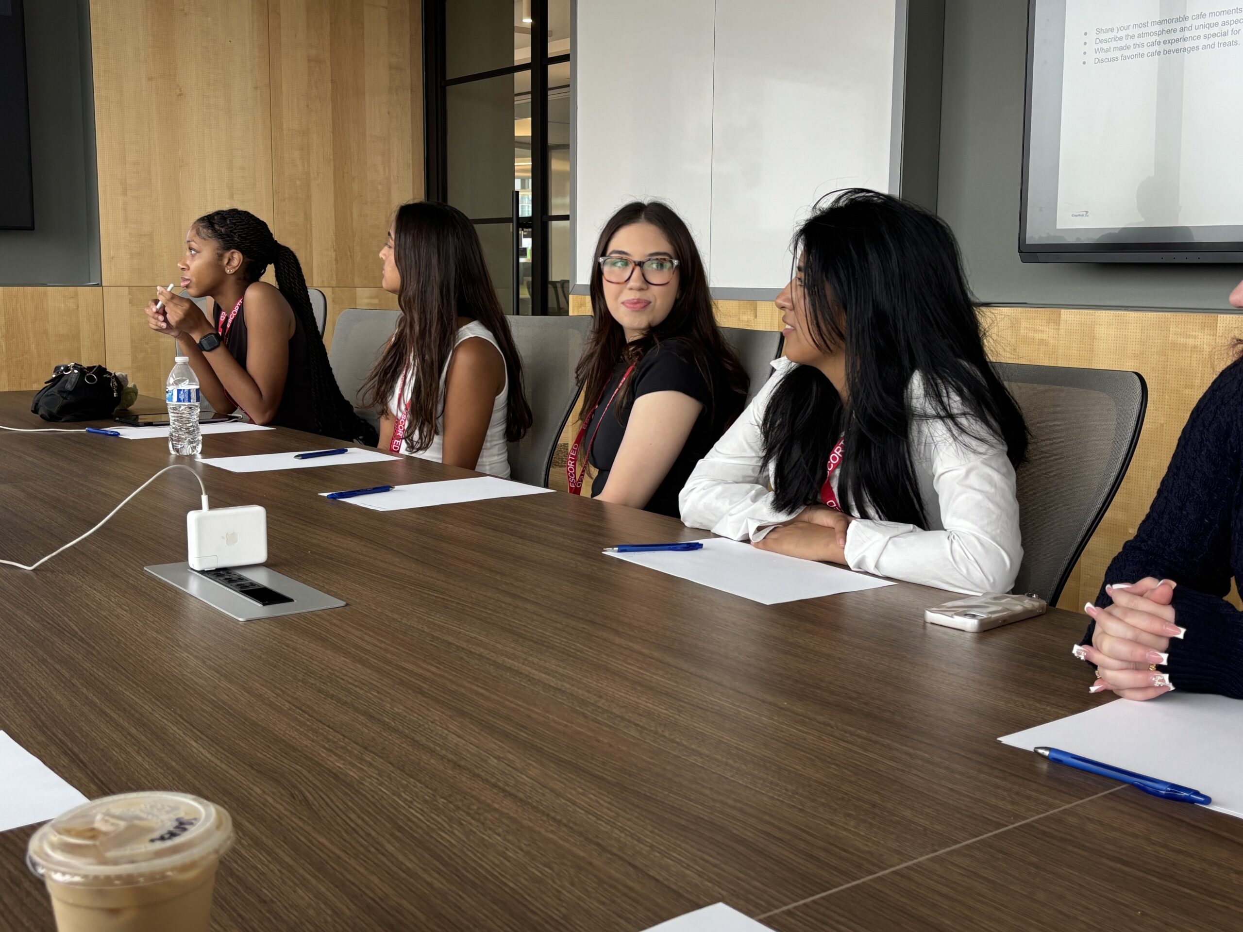Women sitting at a board table in an office
