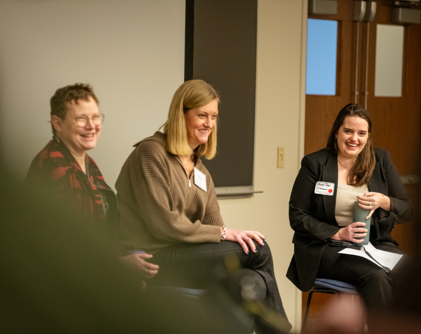 Our founder Sue smiling at a speaking engagement