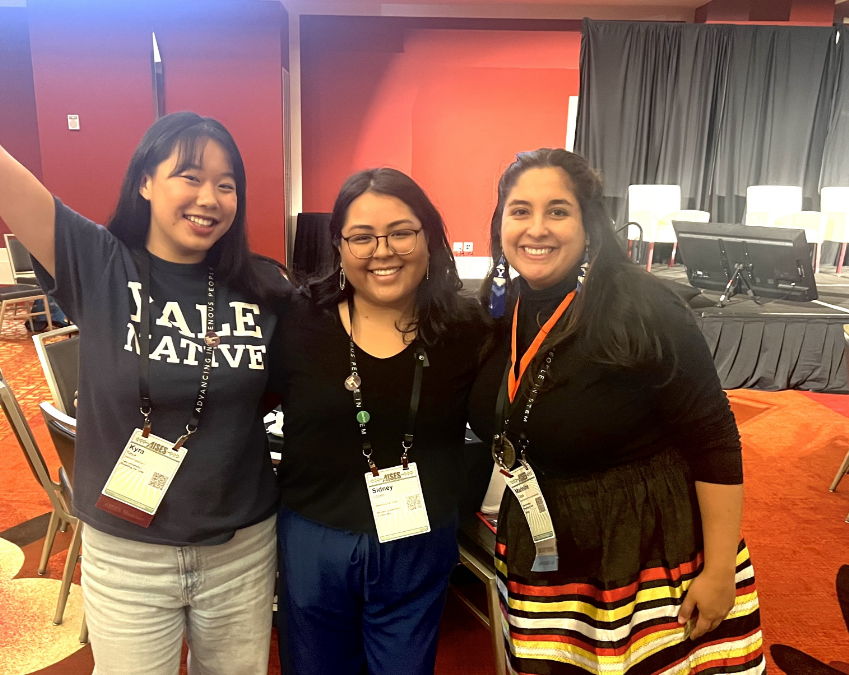 2 members with RTC team member Sidney in between them, all smiling