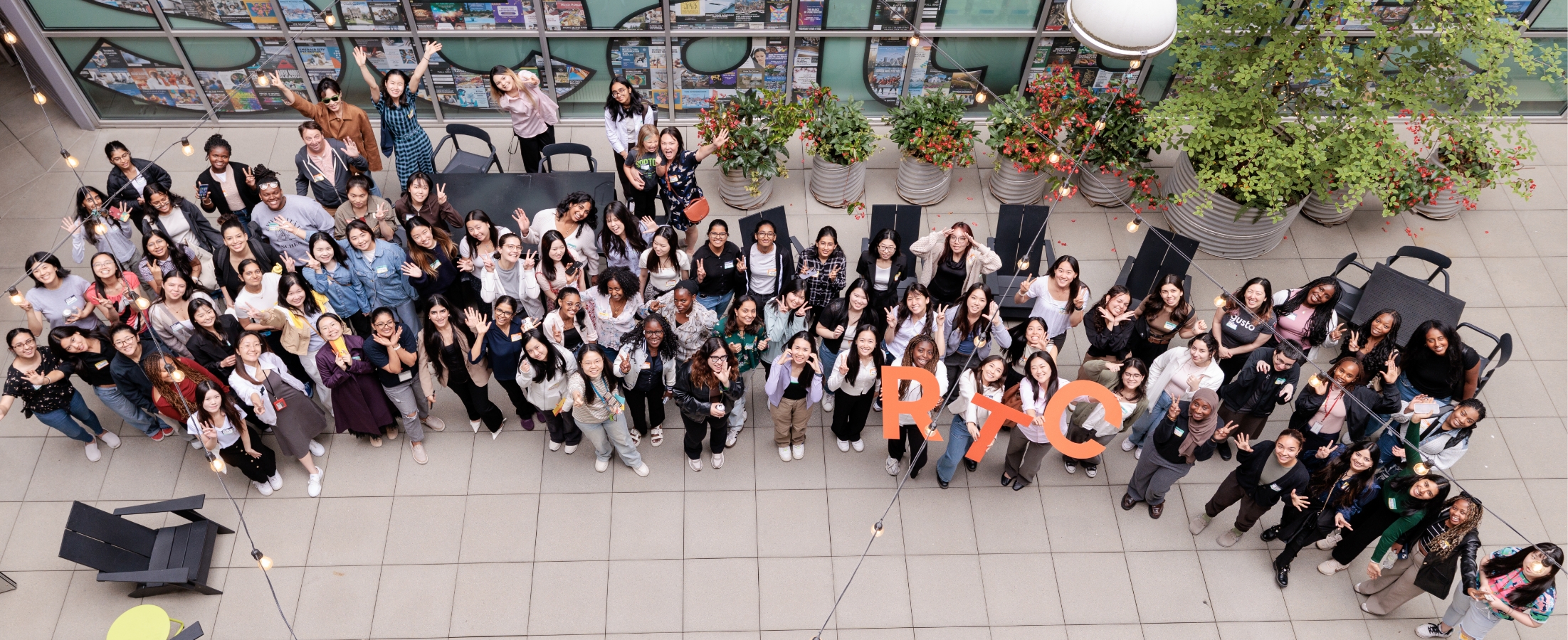 Group of women outside smiling with an RTC sign