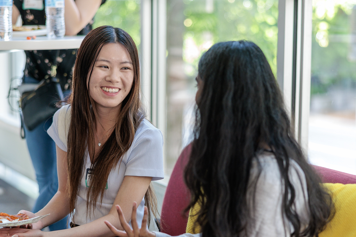 two women smiling at each other