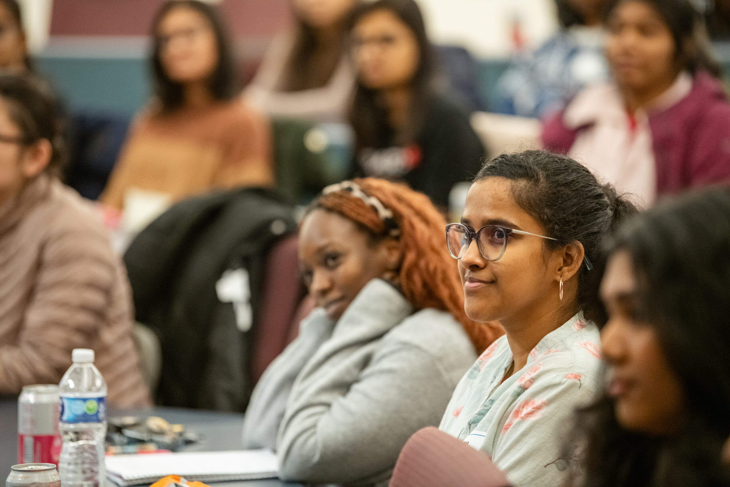 women watching speaker