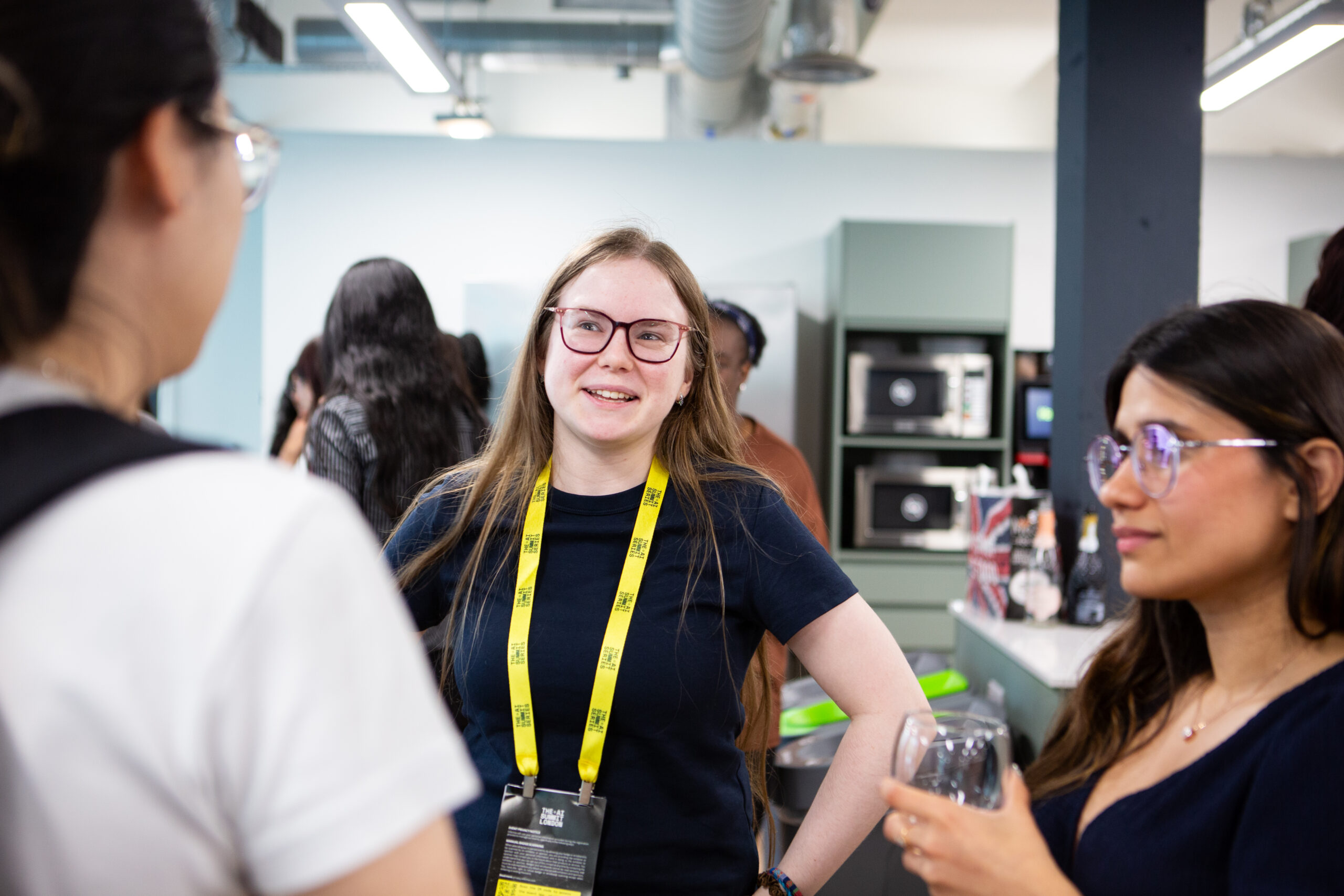 Women in a circle talking at an event