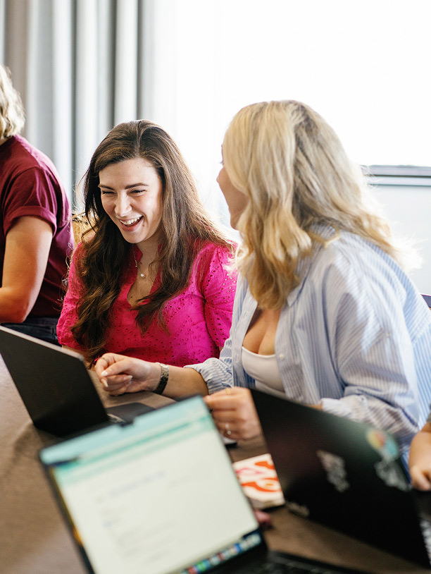 Jessica Furness and Jess Rush laughing at an RTC staff retreat