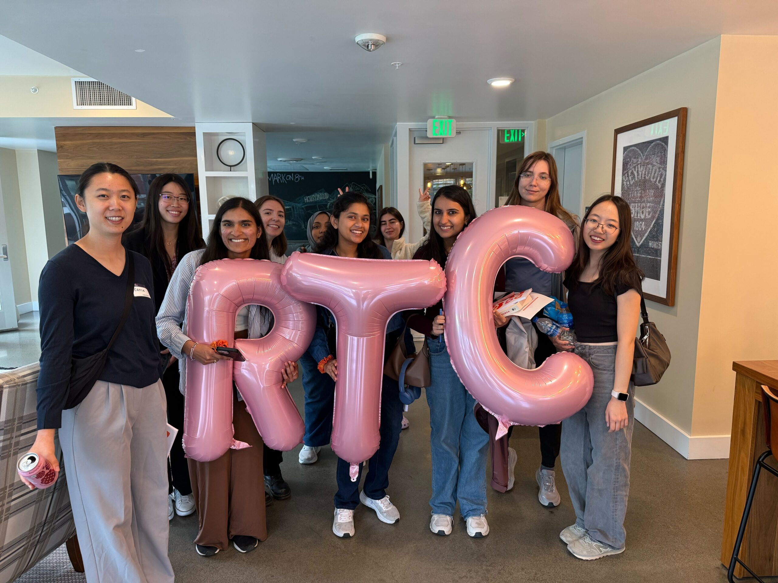Group of early career women holding RTC balloons